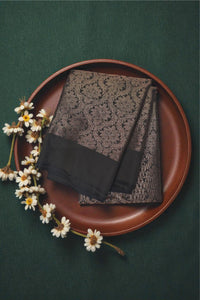 Two scarves on a brown plate with flowers on a green background