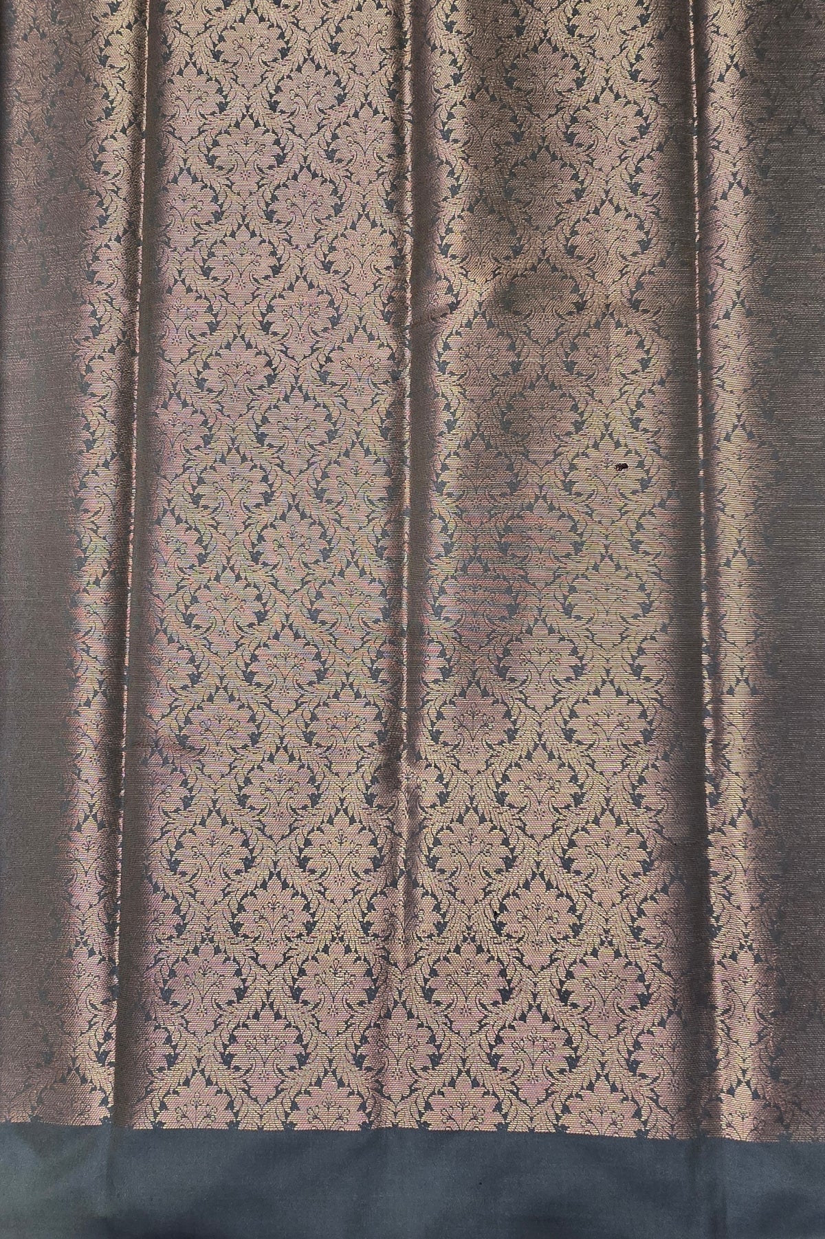 Textured fabric with a patterned design on a dark background