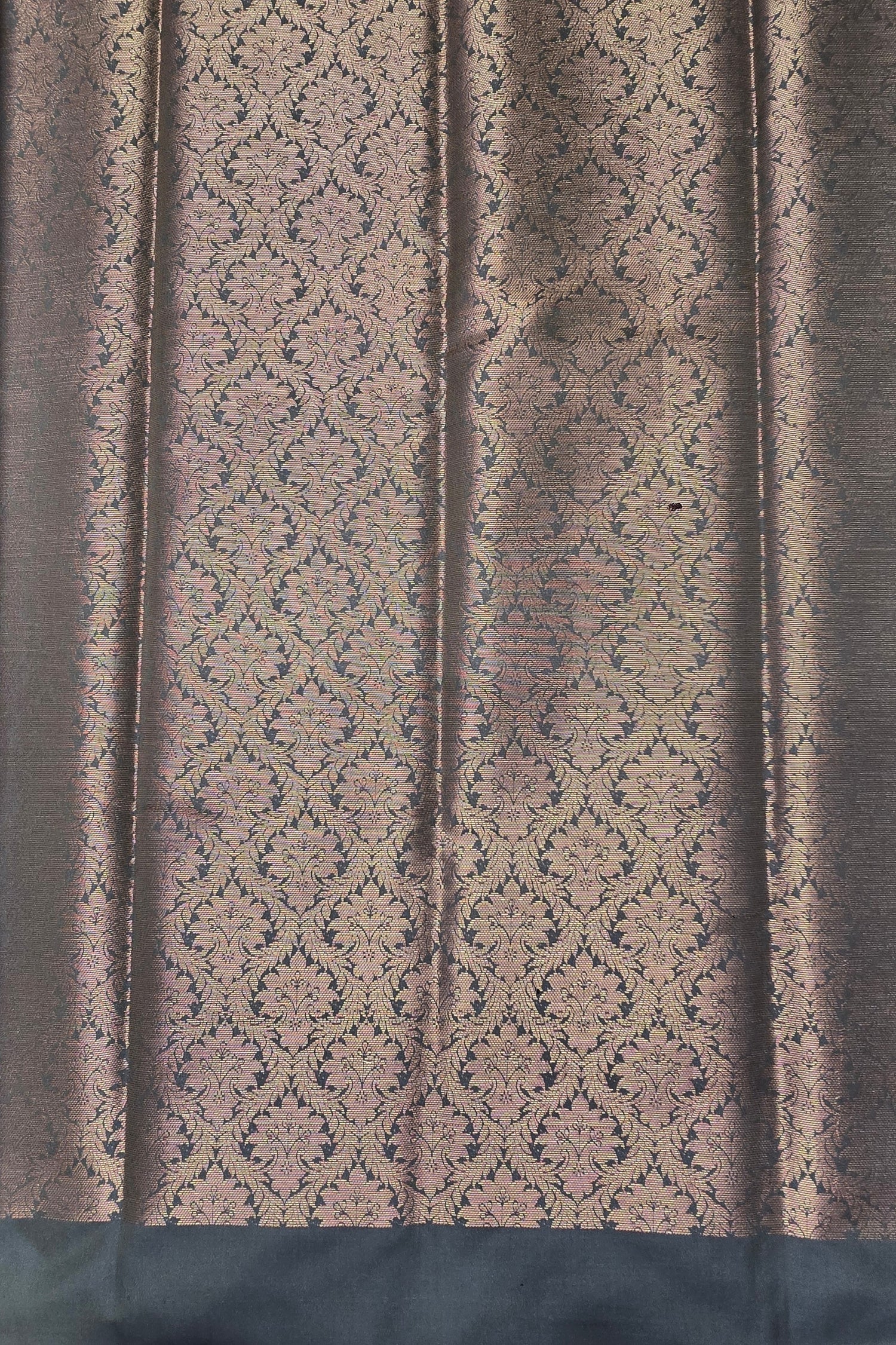 Textured fabric with a patterned design on a dark background