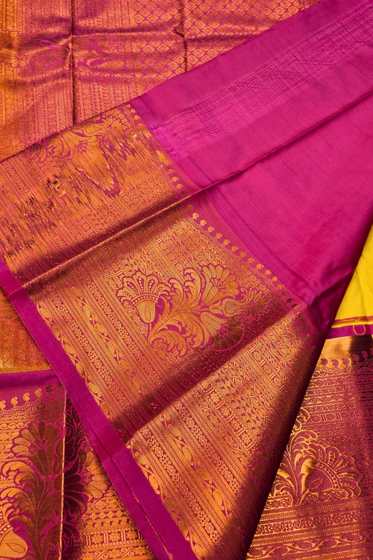 Pink and gold traditional fabric with intricate patterns