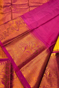 Pink and gold traditional fabric with intricate patterns