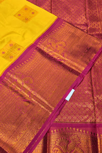 Traditional saree with yellow, pink, and gold patterns