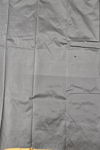 Gray fabric with a subtle pattern and yellow trim at the bottom