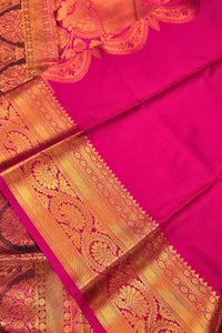 Pink saree with gold border and intricate patterns