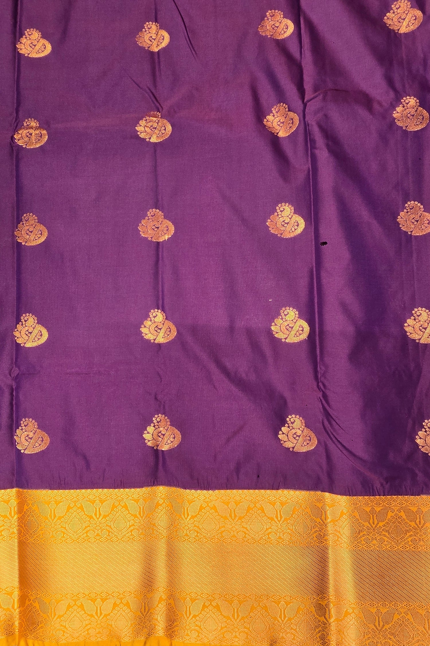 Purple fabric with gold patterns and a yellow border
