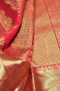Close-up of a red and gold patterned fabric