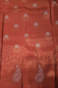 Red fabric with intricate white patterns