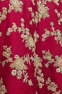 Red fabric with gold floral embroidery