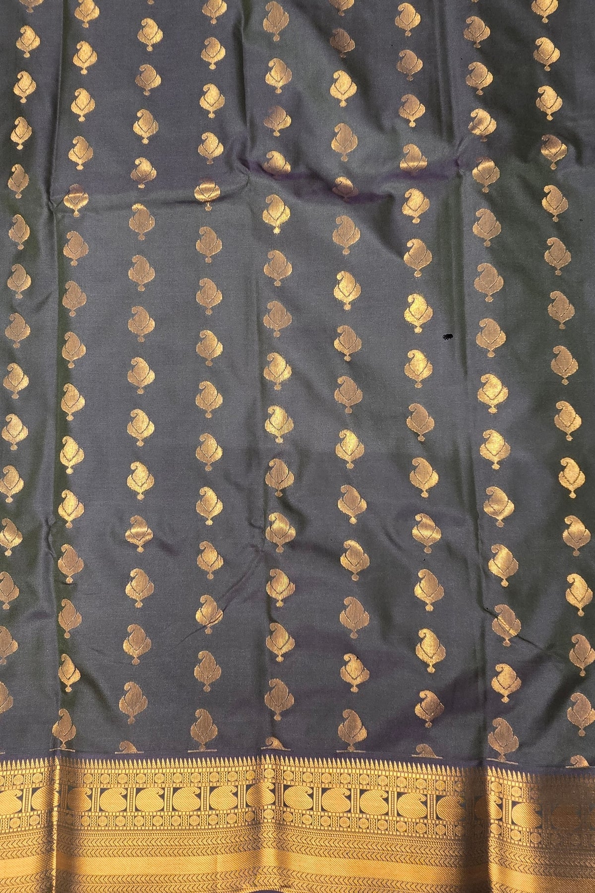 Dark blue fabric with gold floral patterns and border