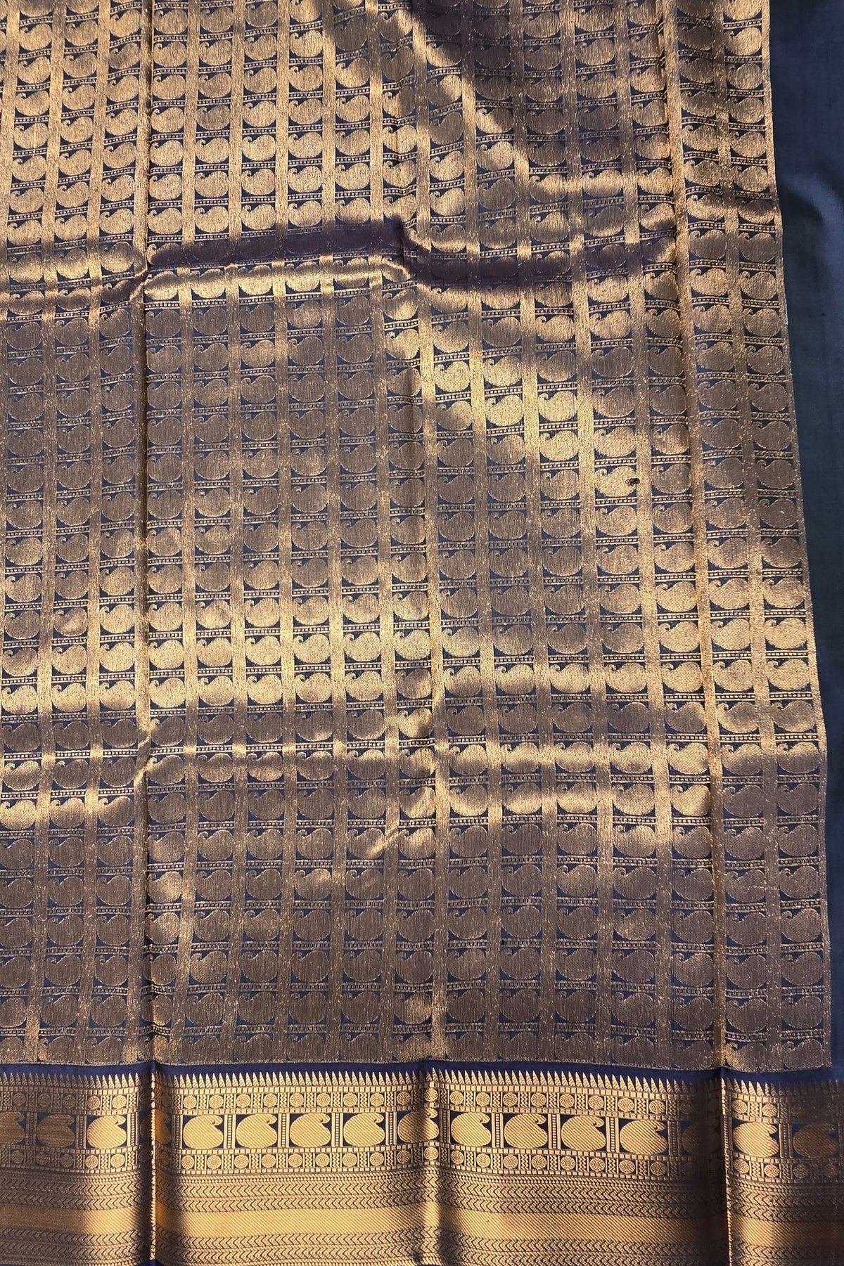 Textured fabric with a geometric pattern and decorative border