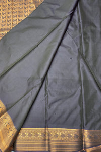 Dark blue fabric with gold border on a textured surface