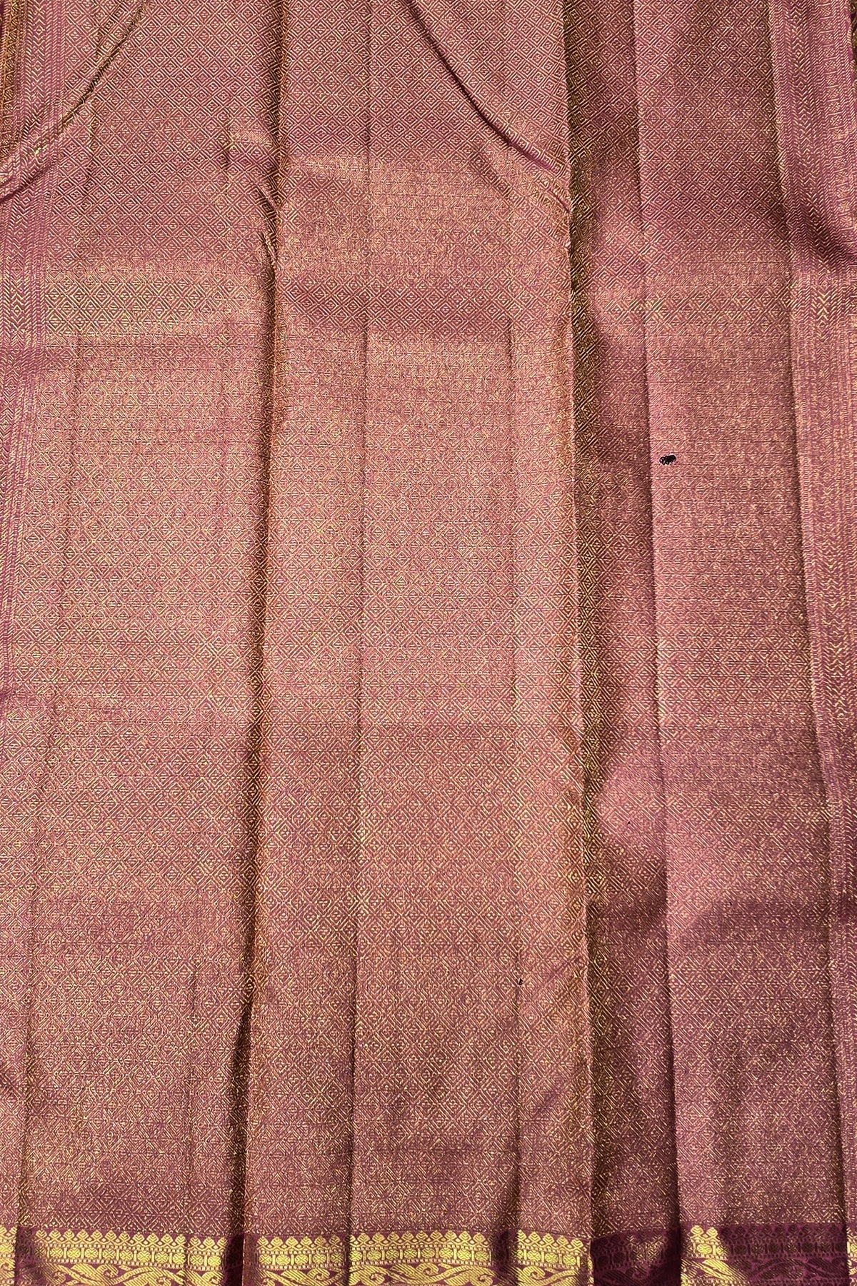 Close-up of a fabric with a checkered pattern and gold border.