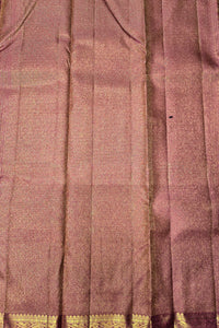 Close-up of a fabric with a checkered pattern and gold border.