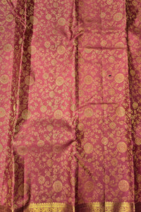 Pink fabric with gold intricate patterns