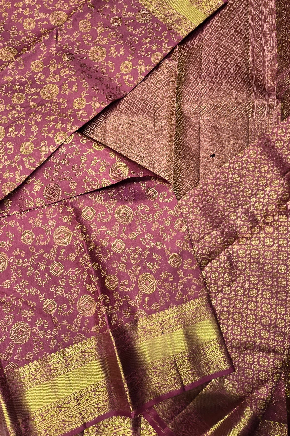 Purple fabric with gold patterns and borders