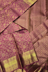 Purple fabric with gold patterns and borders