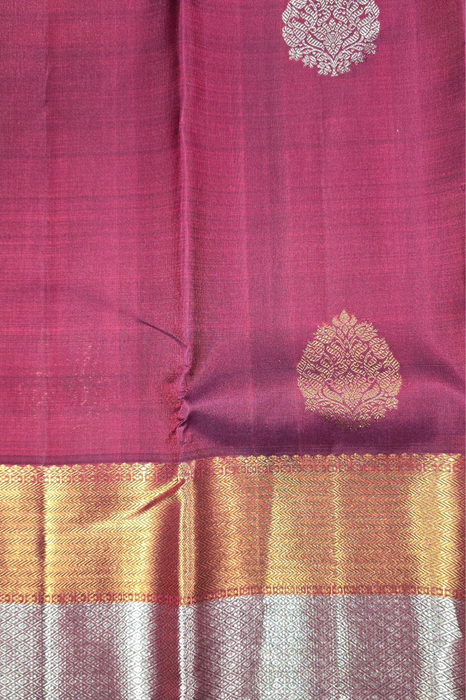 Pink fabric with gold and white patterns