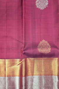 Pink fabric with gold and white patterns