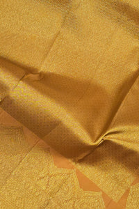 Close-up of gold fabric with intricate patterns