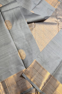 Gray fabric with gold accents and patterns