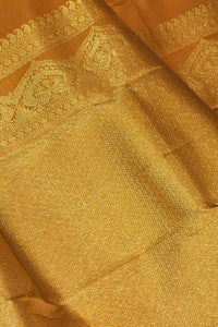 Close-up of gold fabric with intricate patterns
