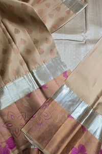 Close-up of a fabric with floral patterns and silver border