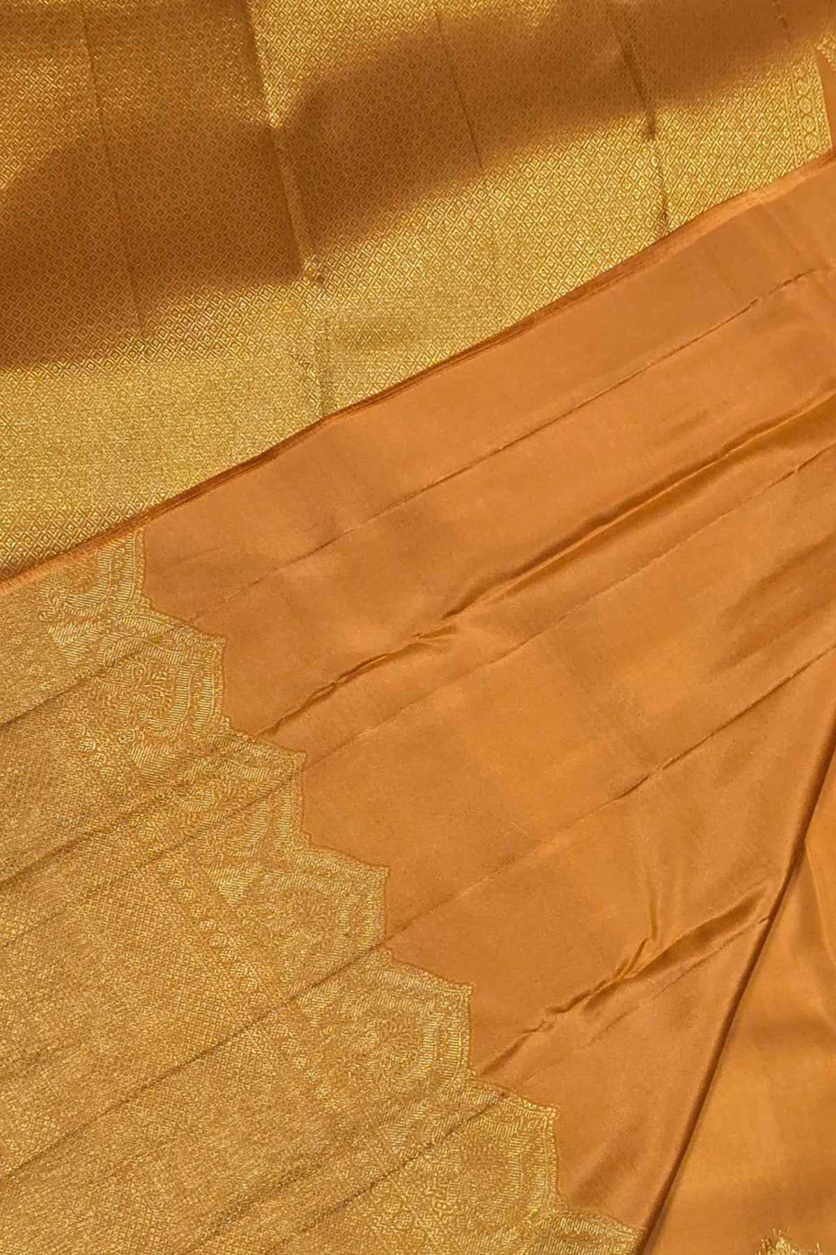 Close-up of a gold fabric with intricate patterns