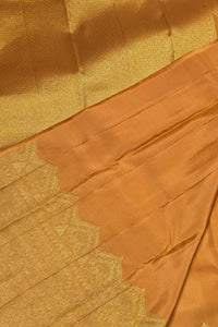 Close-up of a gold fabric with intricate patterns