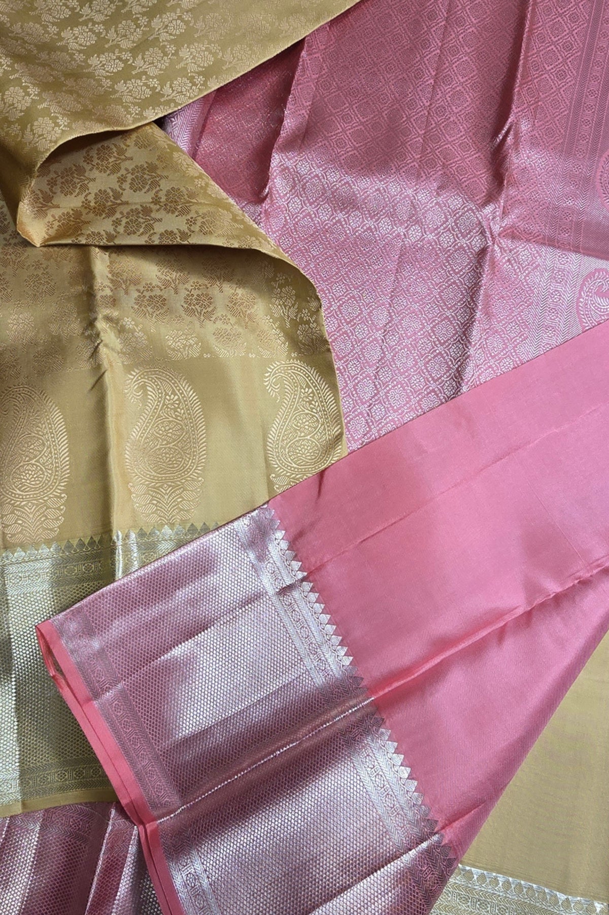 Close-up of pink and gold fabric with intricate patterns