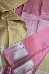 Close-up of pink and gold fabric with intricate patterns