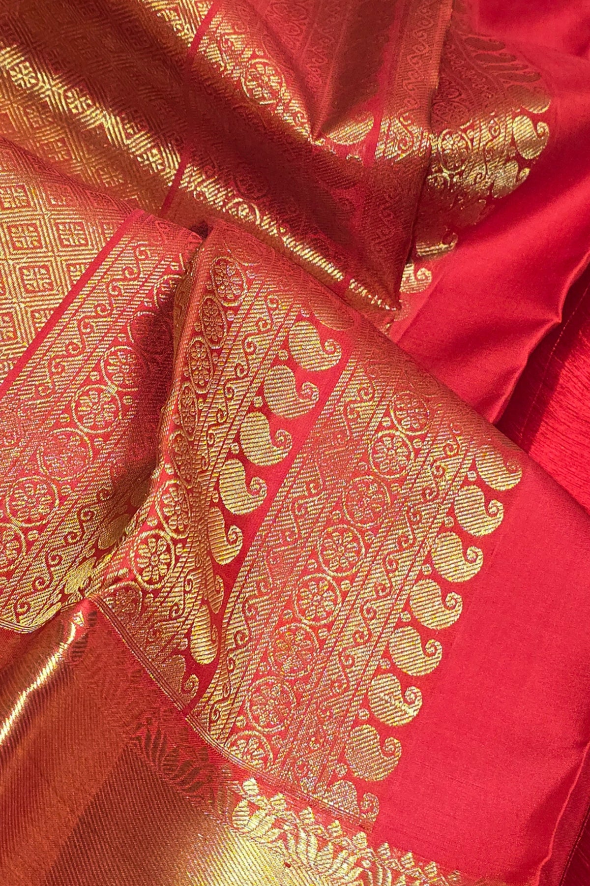 Red fabric with gold intricate patterns