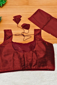Red satin top on a wooden surface