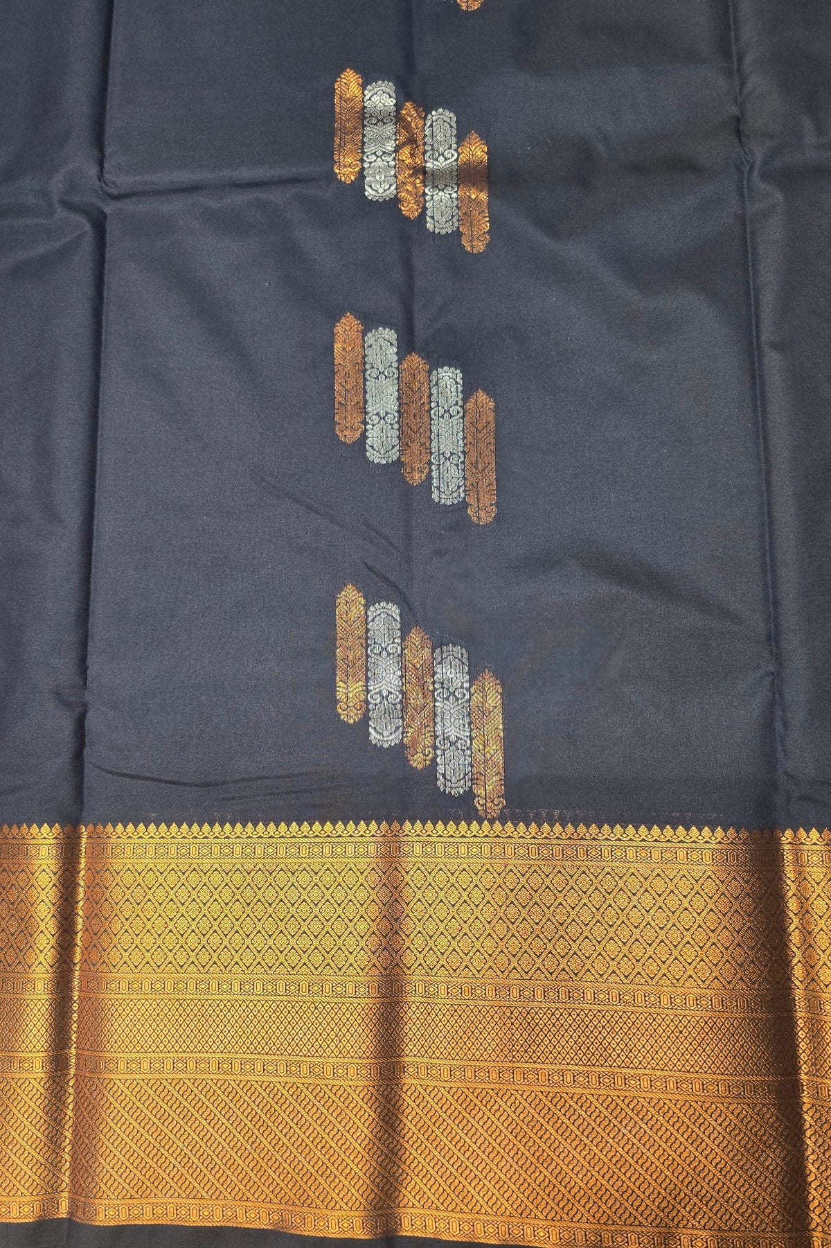 Dark blue fabric with gold and silver embroidery