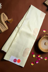 Light-colored fabric with a pattern on a brown surface with decorative elements.