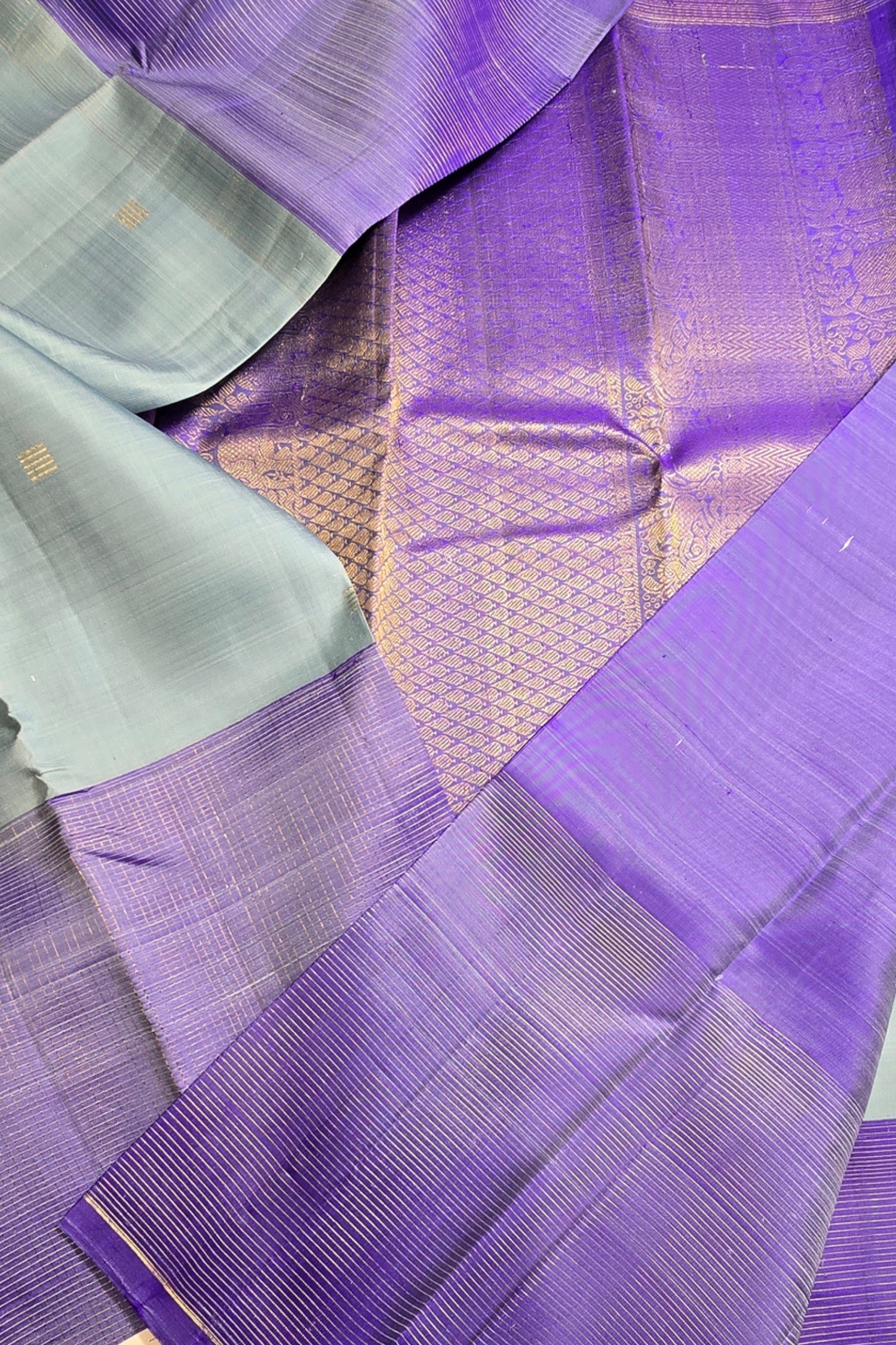 Close-up of a purple fabric with a textured pattern