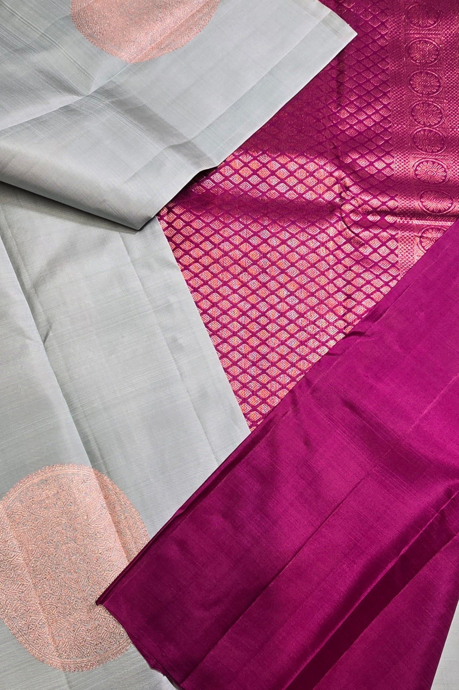 Close-up of a fabric with pink and gray patterns