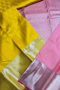 Close-up of yellow and pink fabric with intricate patterns