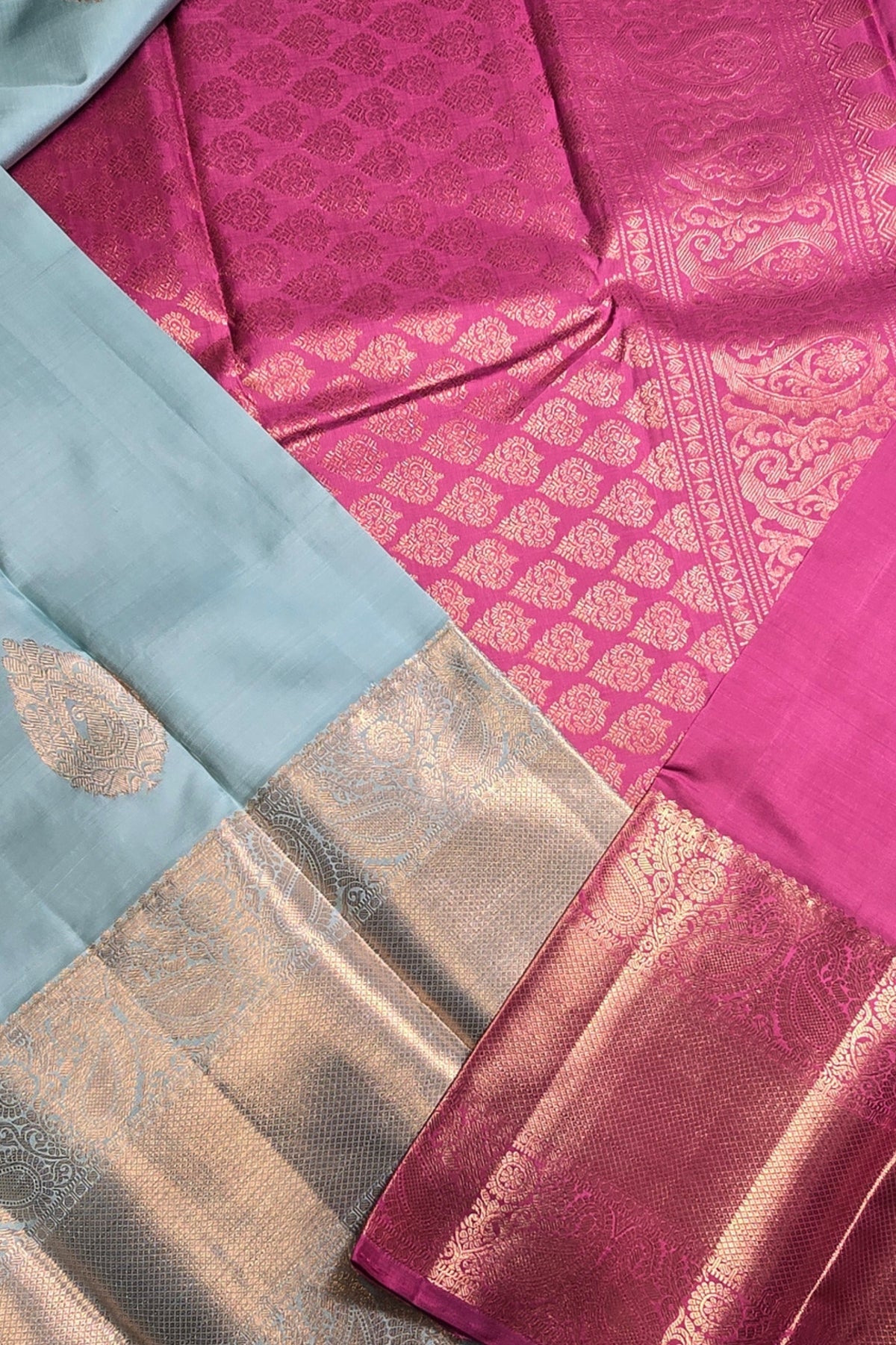 Close-up of a pink and blue fabric with intricate patterns