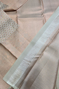 Close-up of beige fabric with a textured pattern