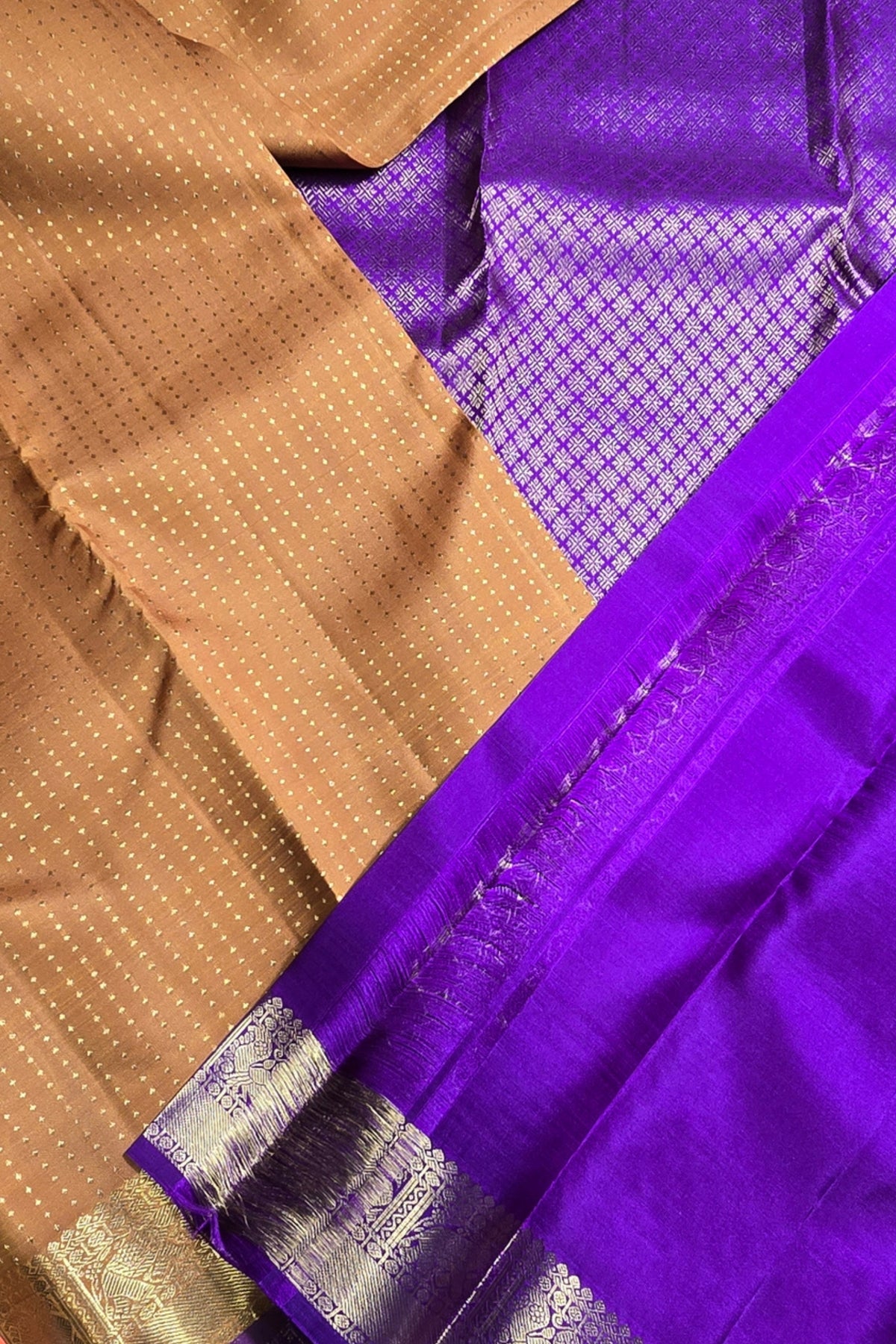 Close-up of a brown and purple fabric with a visible pattern