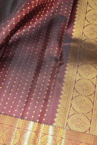 Close-up of a maroon fabric with gold patterns