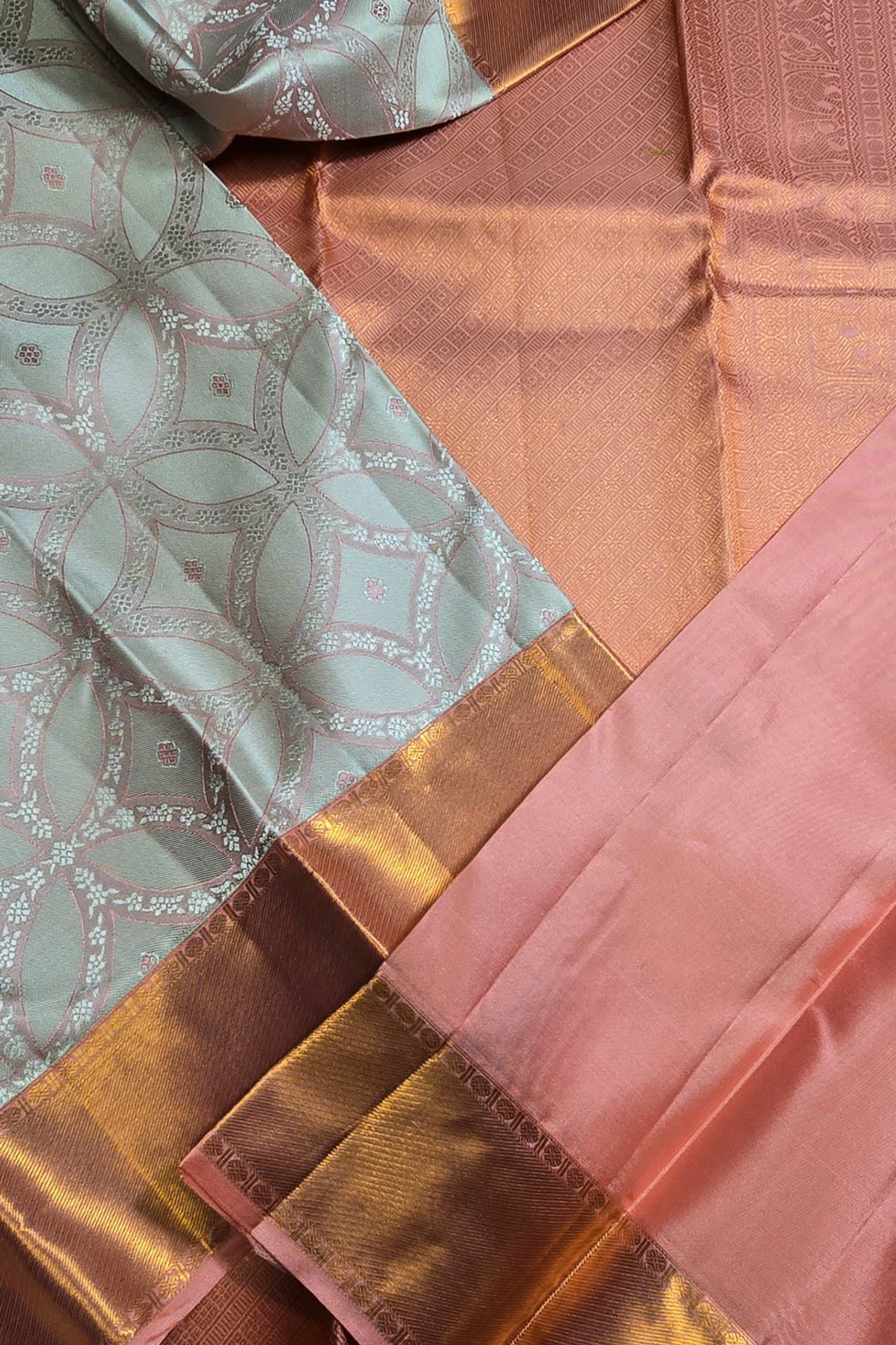 Close-up of patterned fabric with gold and pink tones