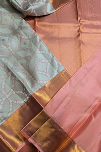 Close-up of patterned fabric with gold and pink tones