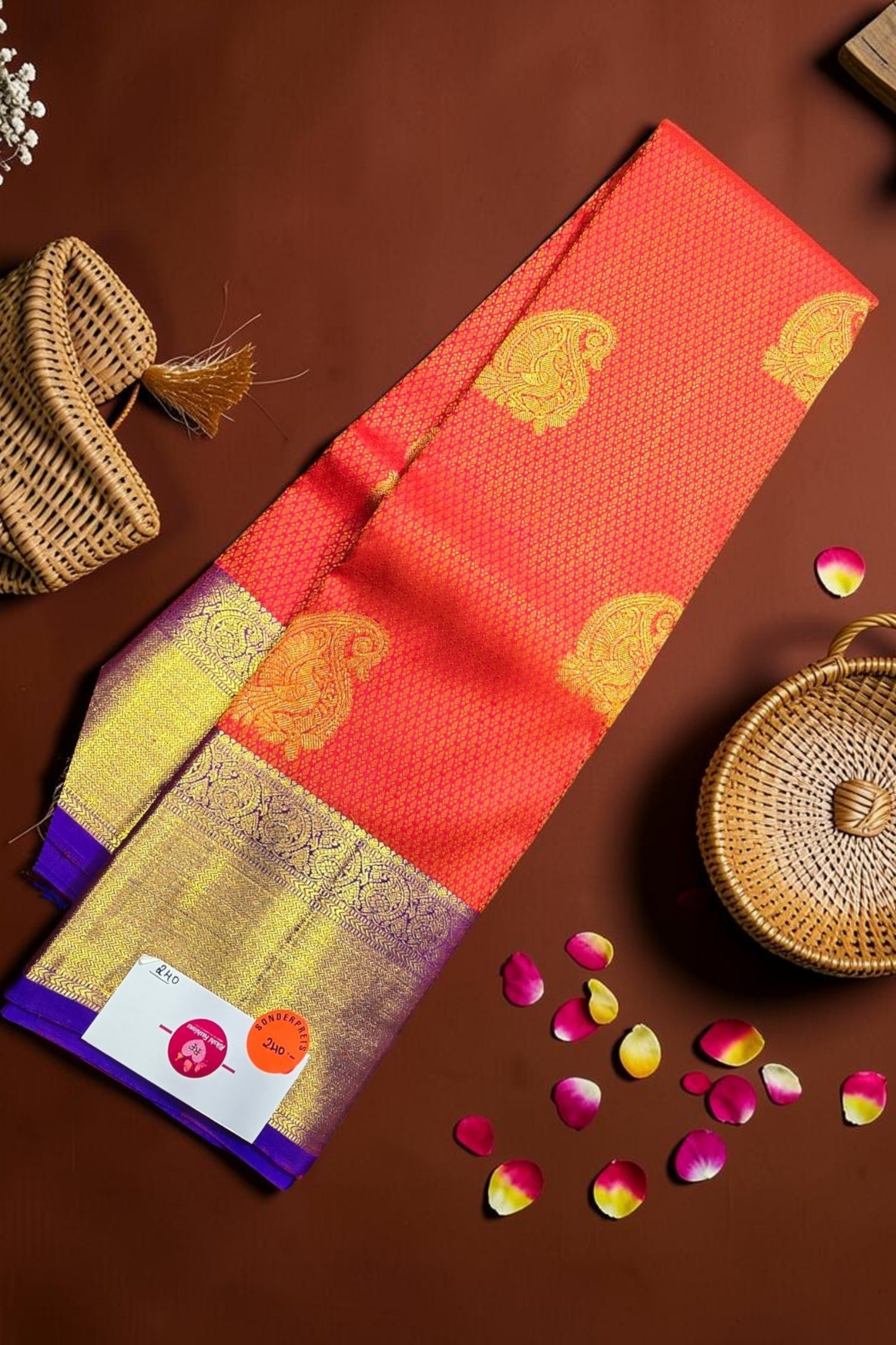 Traditional saree with gold patterns on a brown background