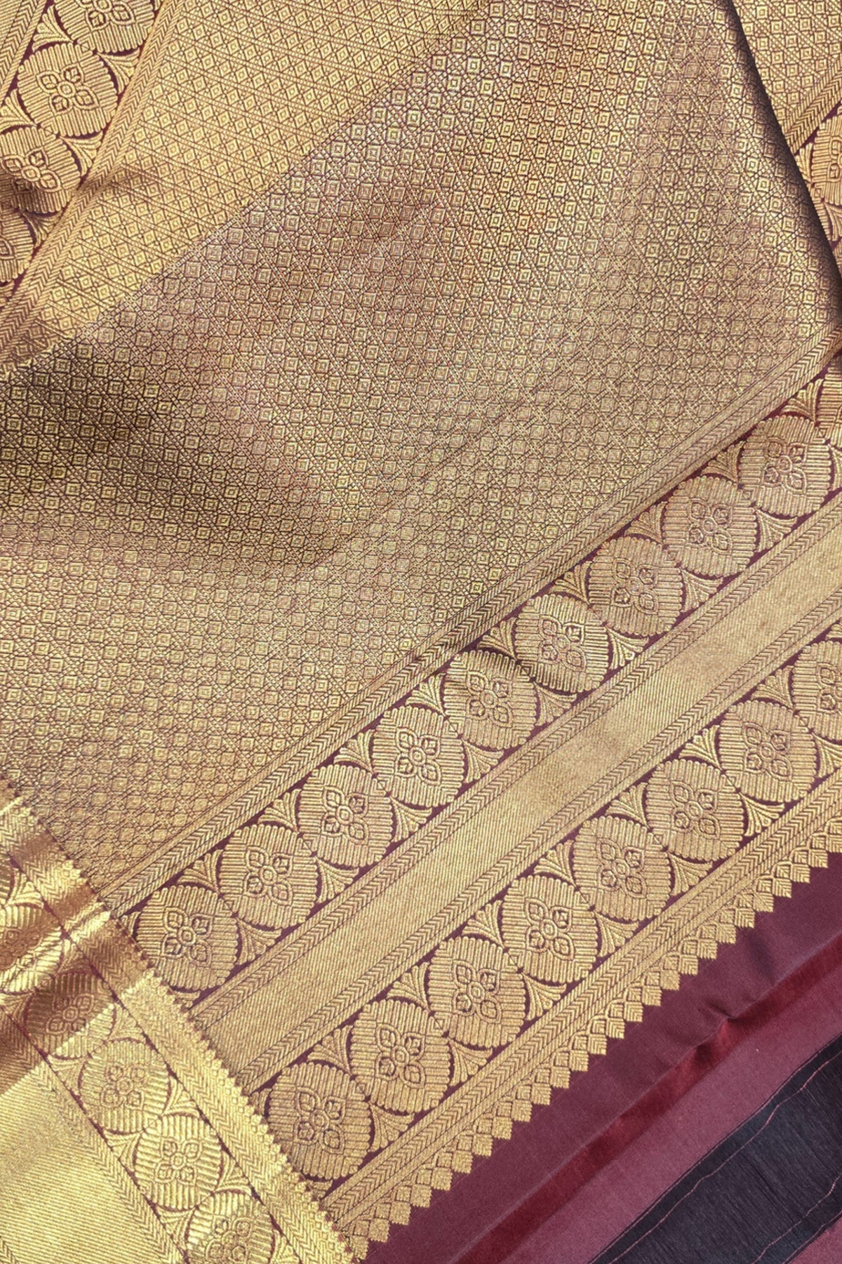 Close-up of a gold fabric with intricate patterns