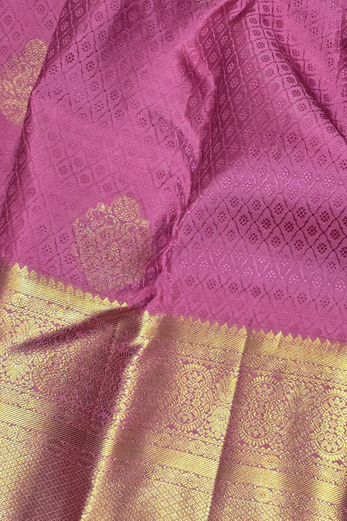Purple fabric with gold border and intricate patterns