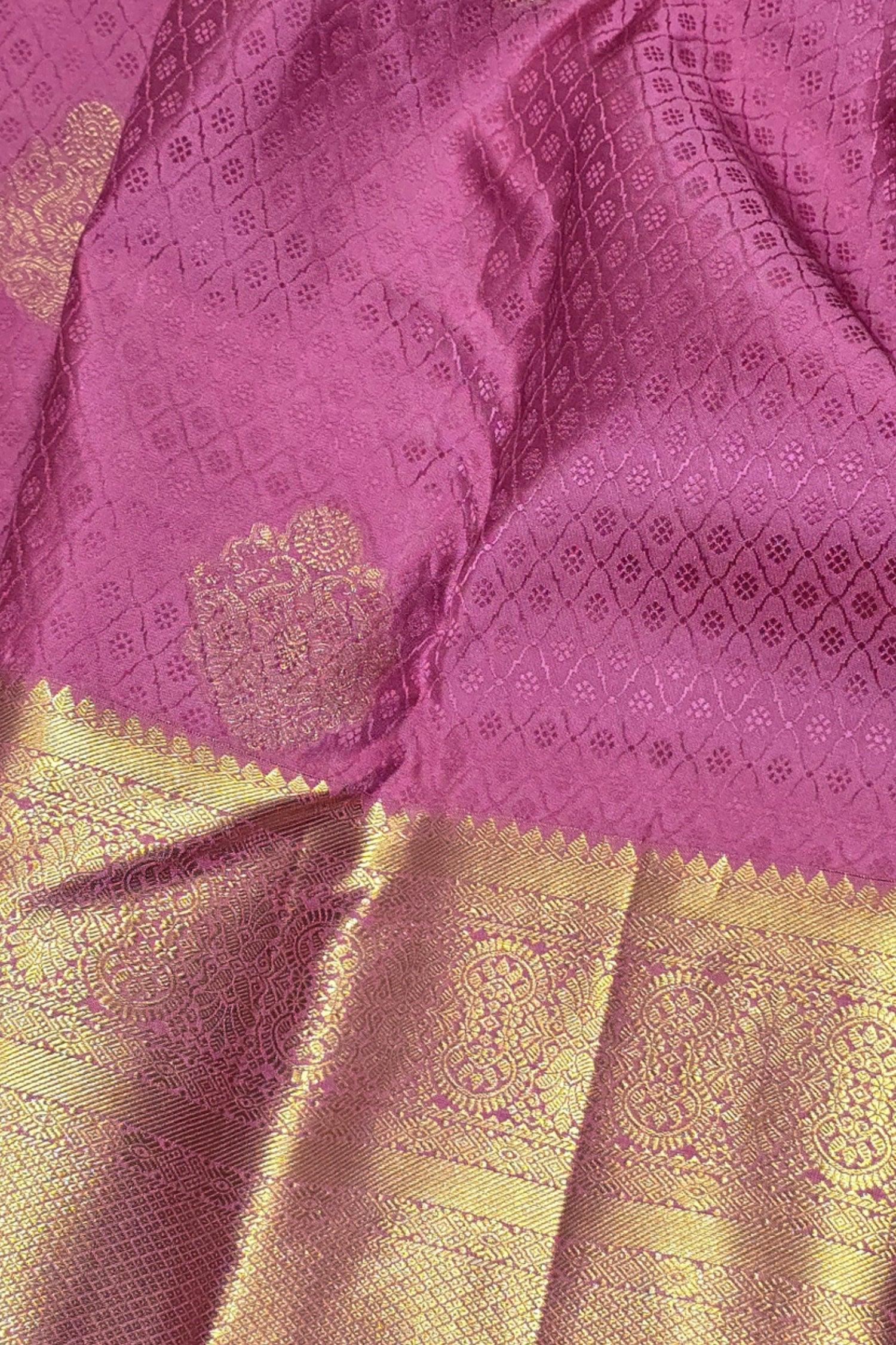 Purple fabric with gold border and intricate patterns