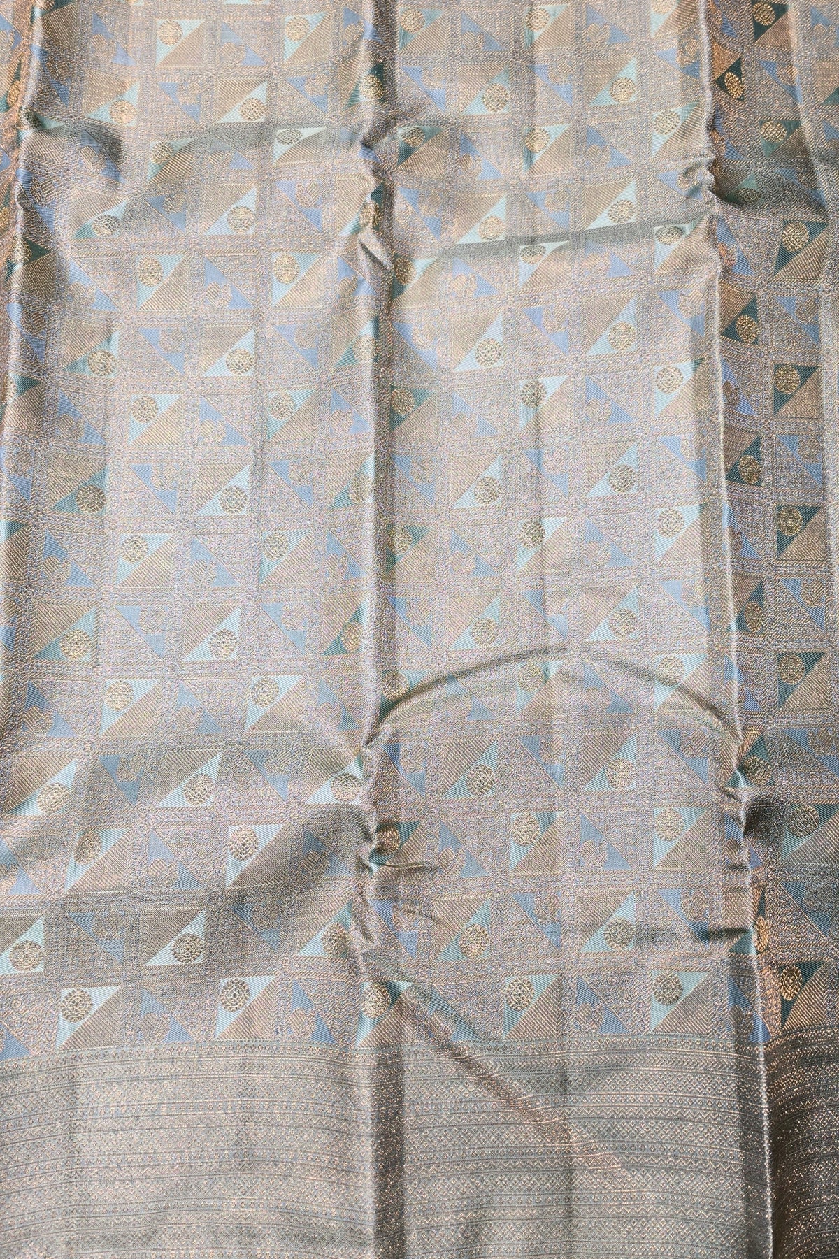 Sheer fabric with geometric pattern in beige and brown tones