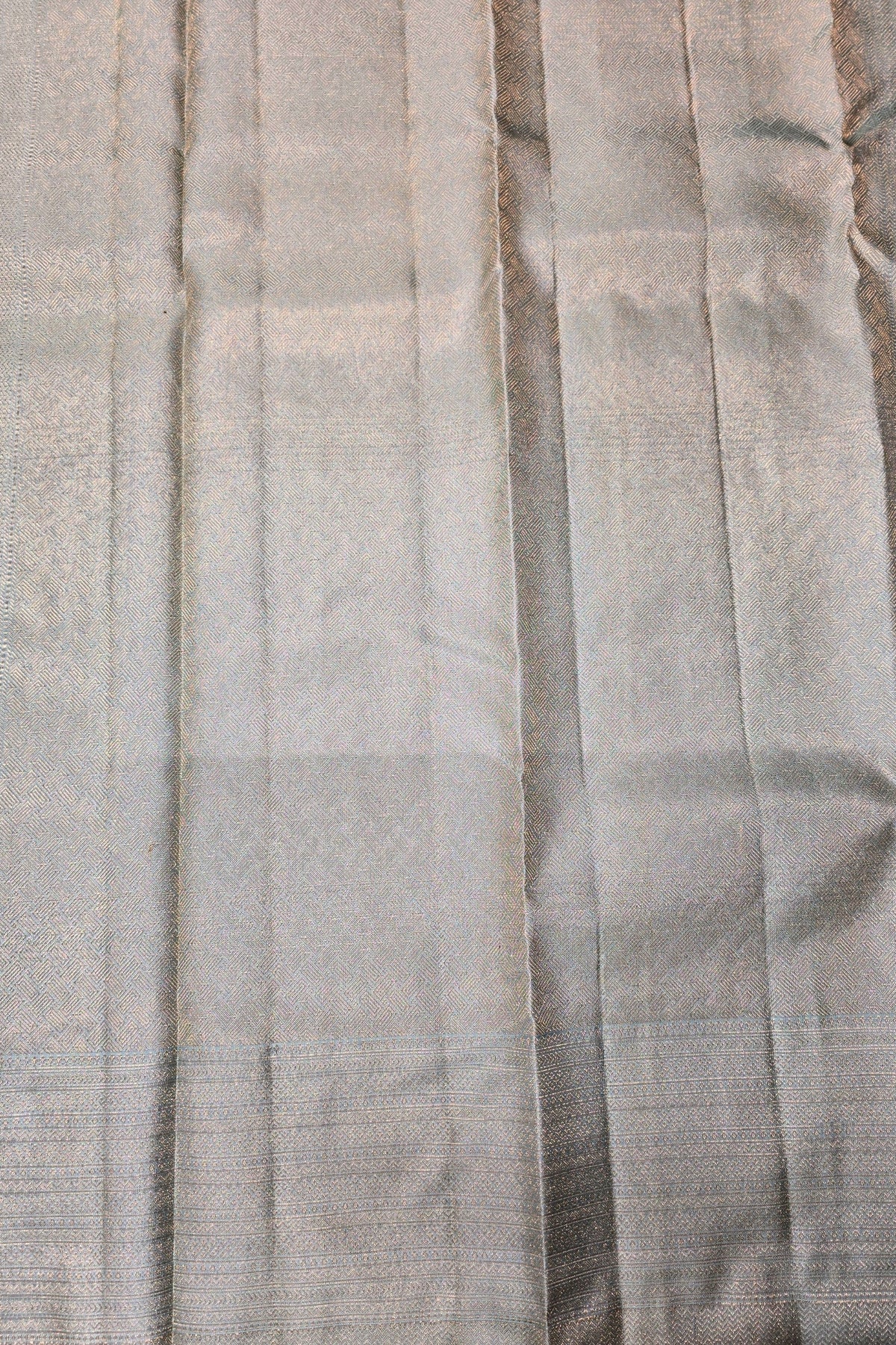 Close-up of pleated fabric with a neutral color palette