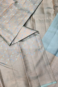 Textured fabric with geometric pattern in shades of brown and blue.